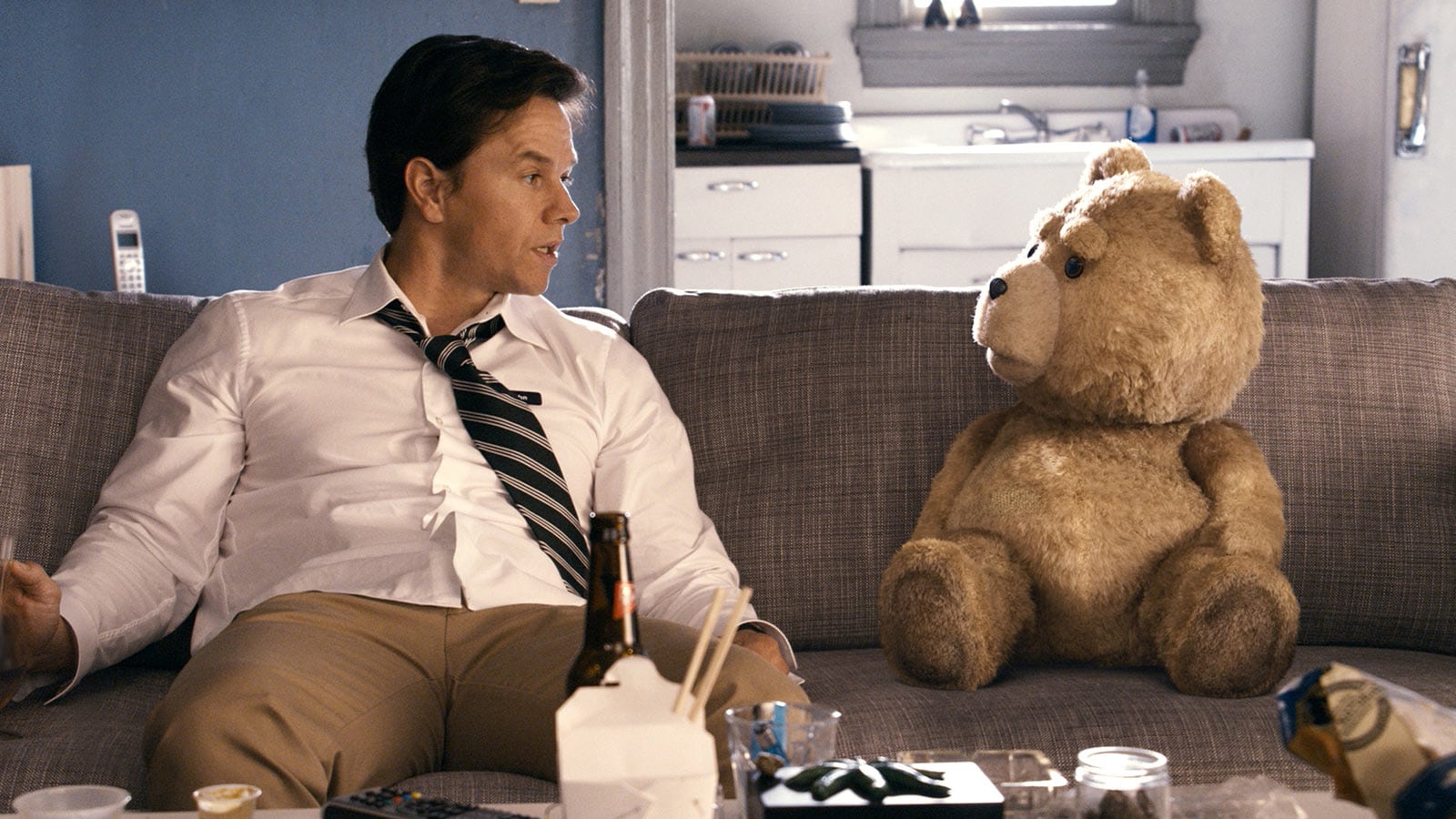 Mark Wahlberg and bear sitting in "Ted"